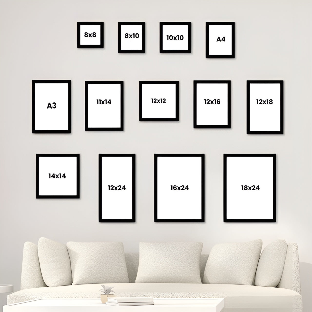 Set of black poster frames with various sizes displayed on a wall above a sofa.