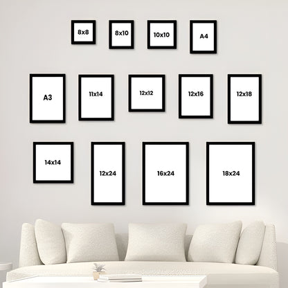 Set of black poster frames with various sizes displayed on a wall above a sofa.