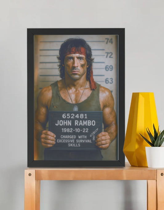 Rambo Mugshot framed poster by PopCrate – 2mm glossy board, 1″ frame, ultra-res print. Action hero survival style for Rambo fans. Under ₹1000
